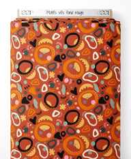 Tissu - Motifs vifs sur fond rouge