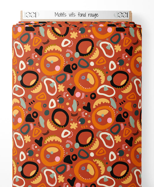 Tissu - Motifs vifs sur fond rouge