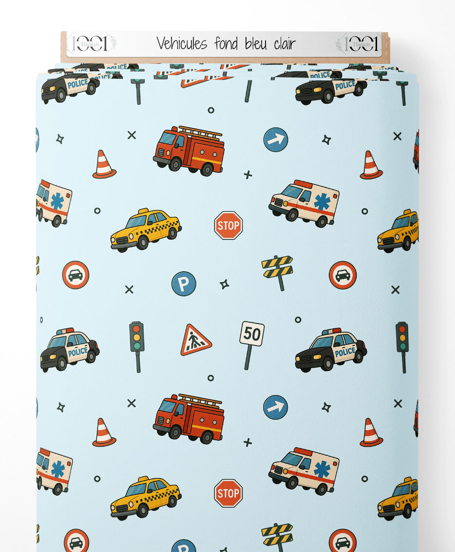 Tissu - Véhicules sur fond bleu clair