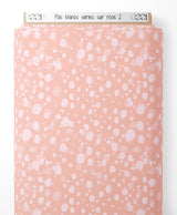 Tissu - Pois blancs variés sur rose 2