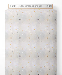 Tissu - Étoiles variées sur gris clair