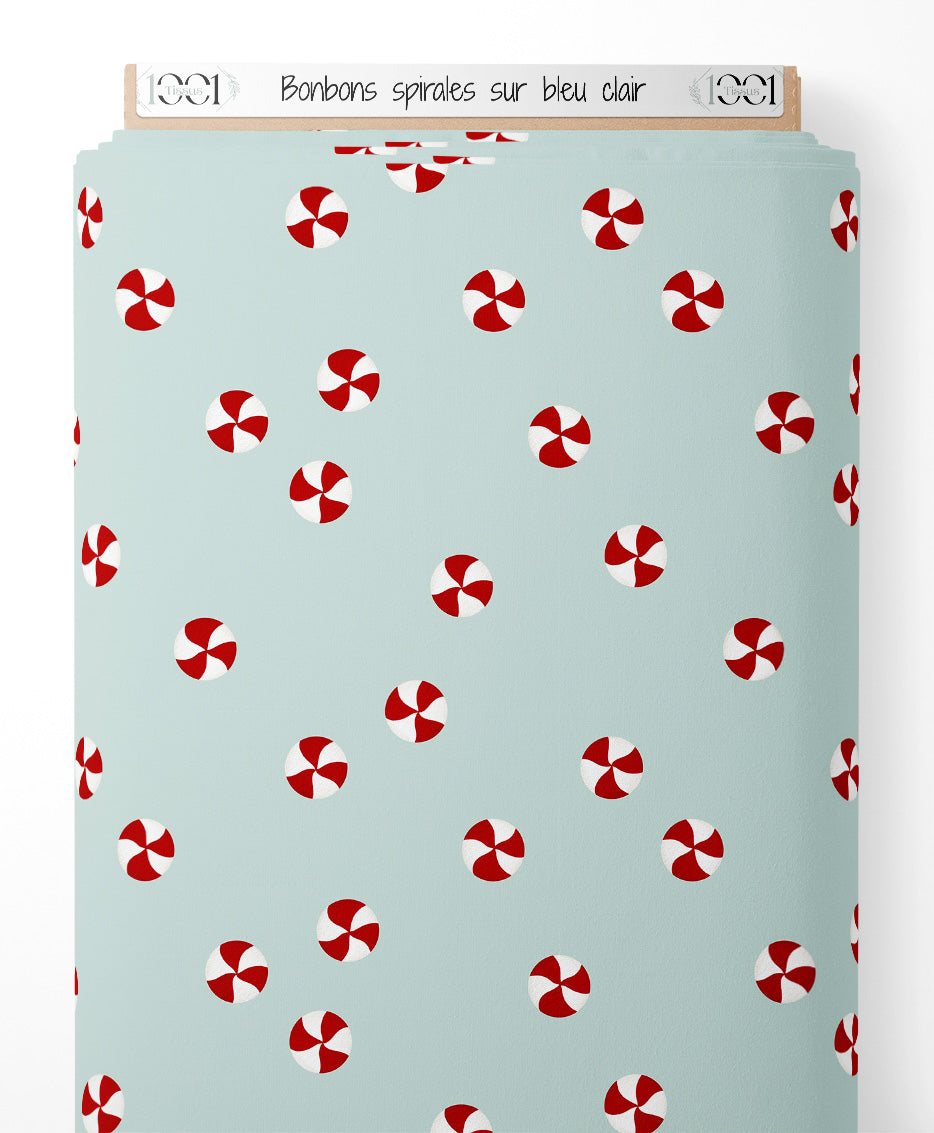 Tissu - Bonbons spirales sur bleu clair