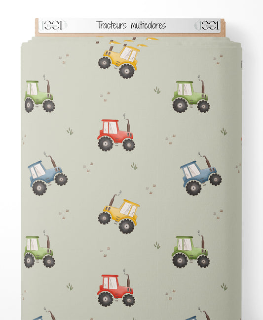 Tissu - Tracteurs multicolores sur fond