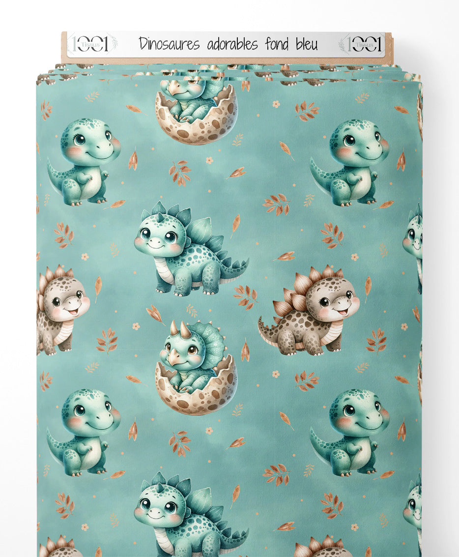 Tissu - Dinosaures adorables sur fond bleu