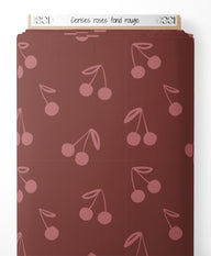 Tissu - Cerises roses sur fond rouge