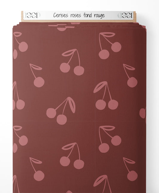 Tissu - Cerises roses sur fond rouge