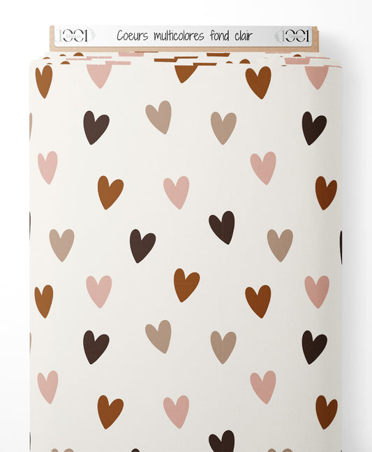 Tissu - Cœurs multicolores sur fond clair