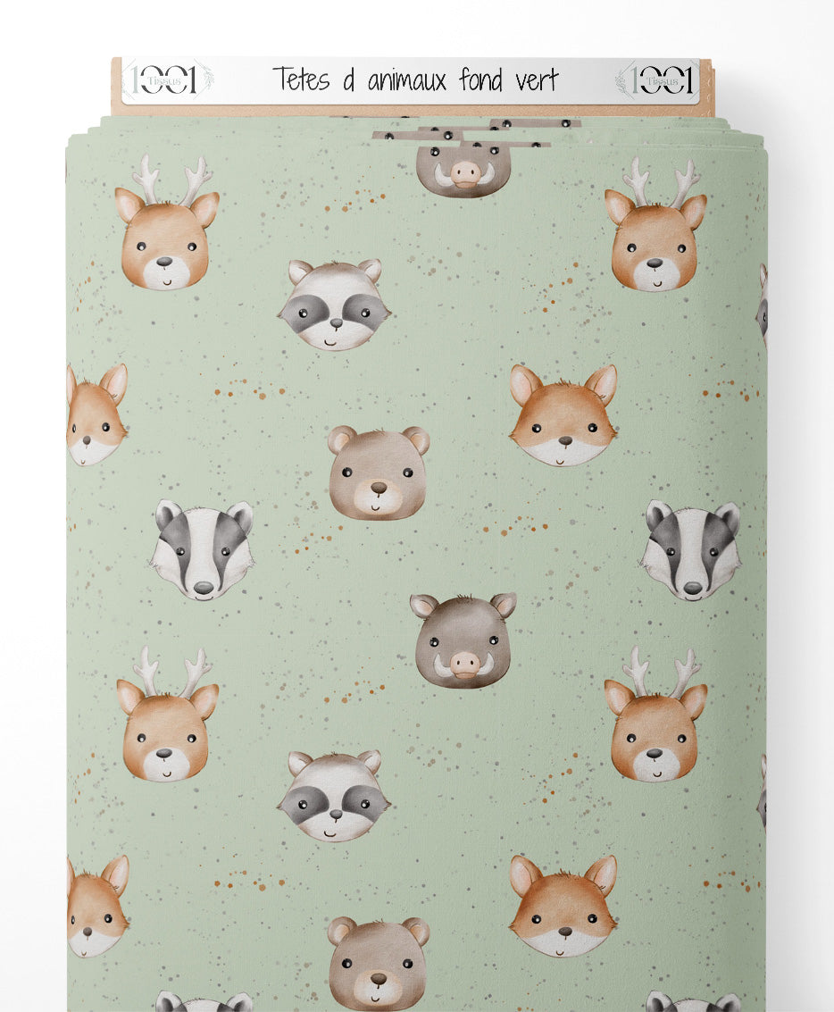 Tissu - Têtes d'animaux sur fond vert