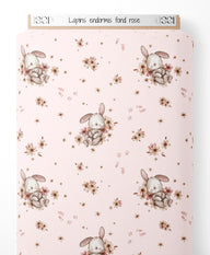 Tissu - Lapins endormis sur fond rose