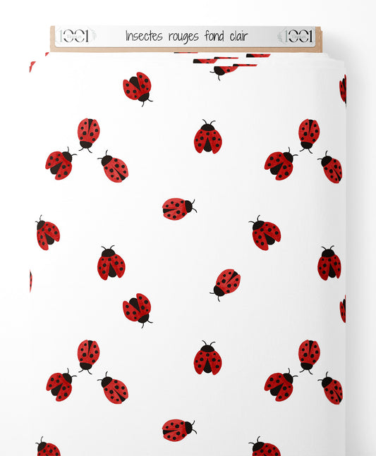 Tissu - Insectes rouges sur fond clair