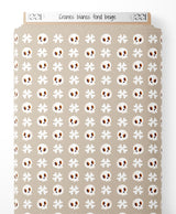 Tissu - Crânes blancs sur fond beige