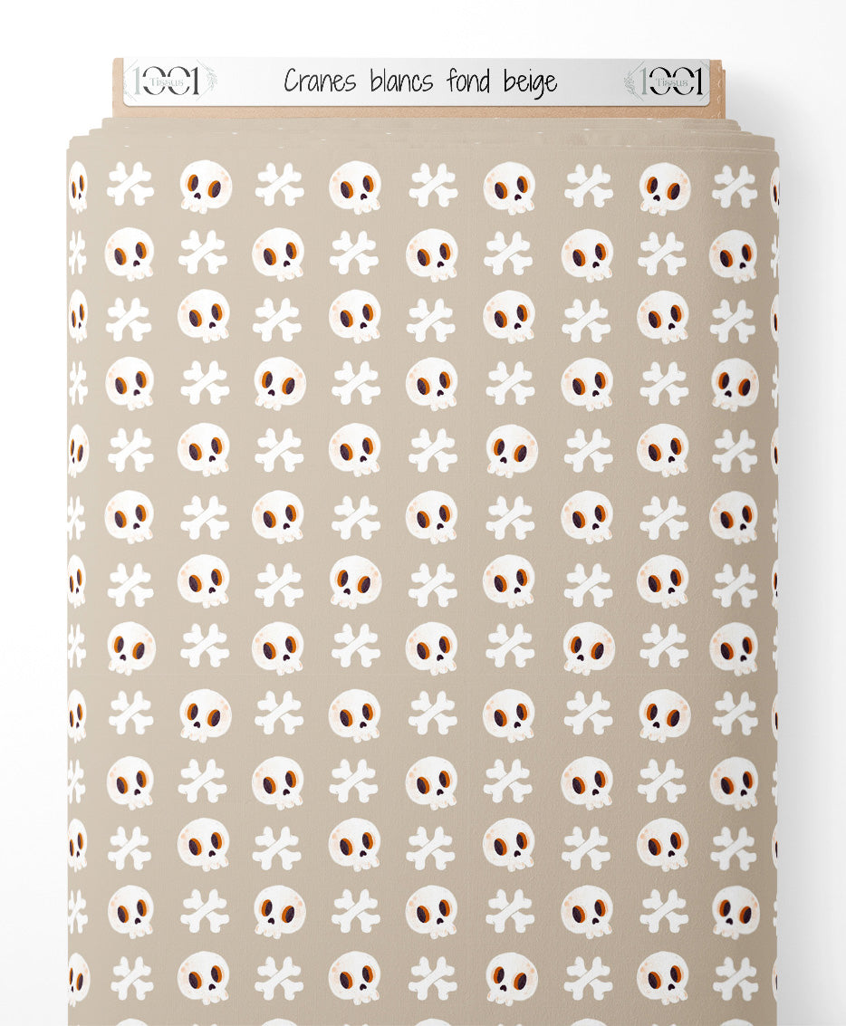 Tissu - Crânes blancs sur fond beige