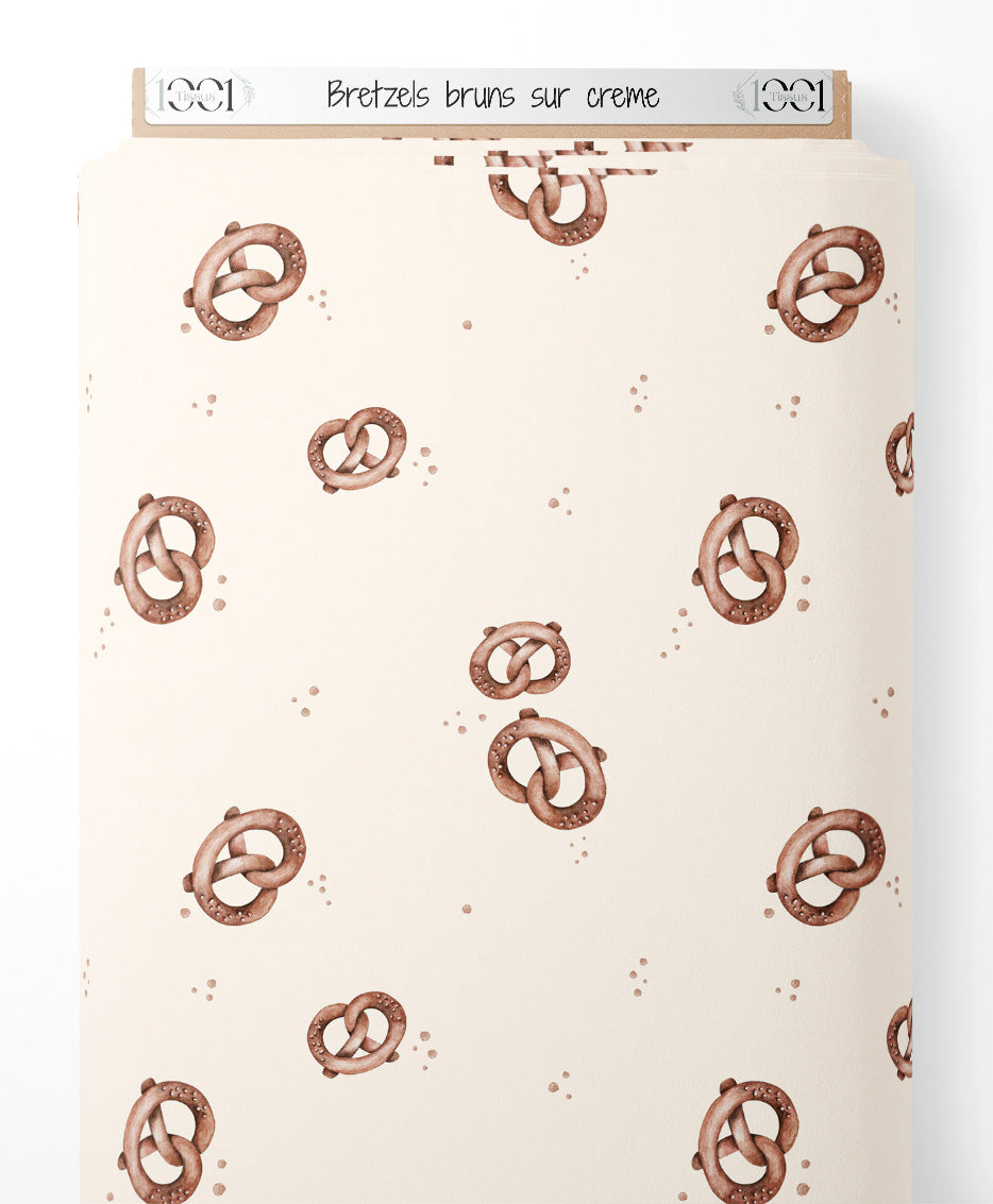 Tissu - Bretzels bruns sur crème