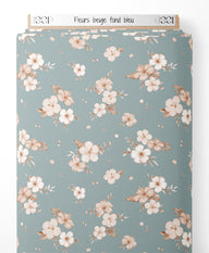 Tissu - Fleurs beige sur fond bleu