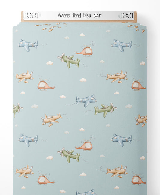 Tissu - Avions sur fond bleu clair