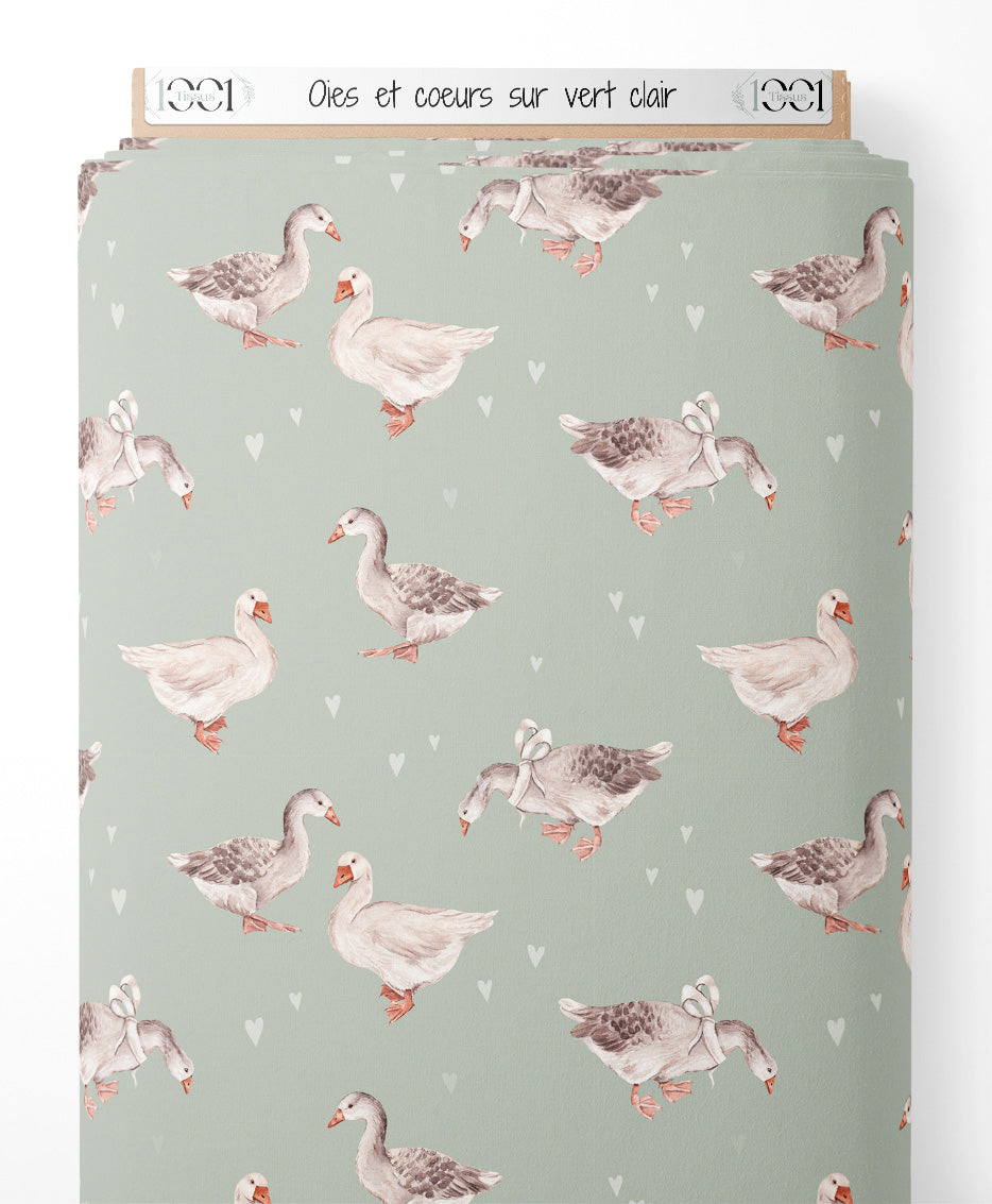 Tissu - Oies et cœurs sur vert clair