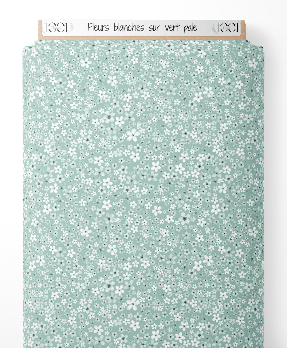 Tissu - Fleurs blanches sur vert pâle