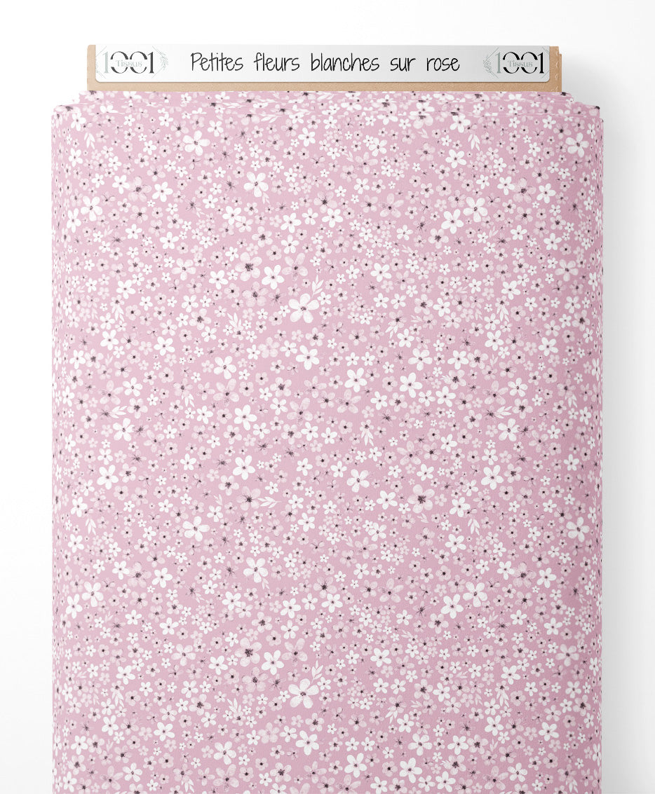 Tissu - Petites fleurs blanches sur rose