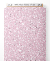 Tissu - Petites fleurs blanches sur rose