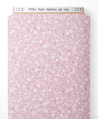 Tissu - Petites fleurs blanches sur rose