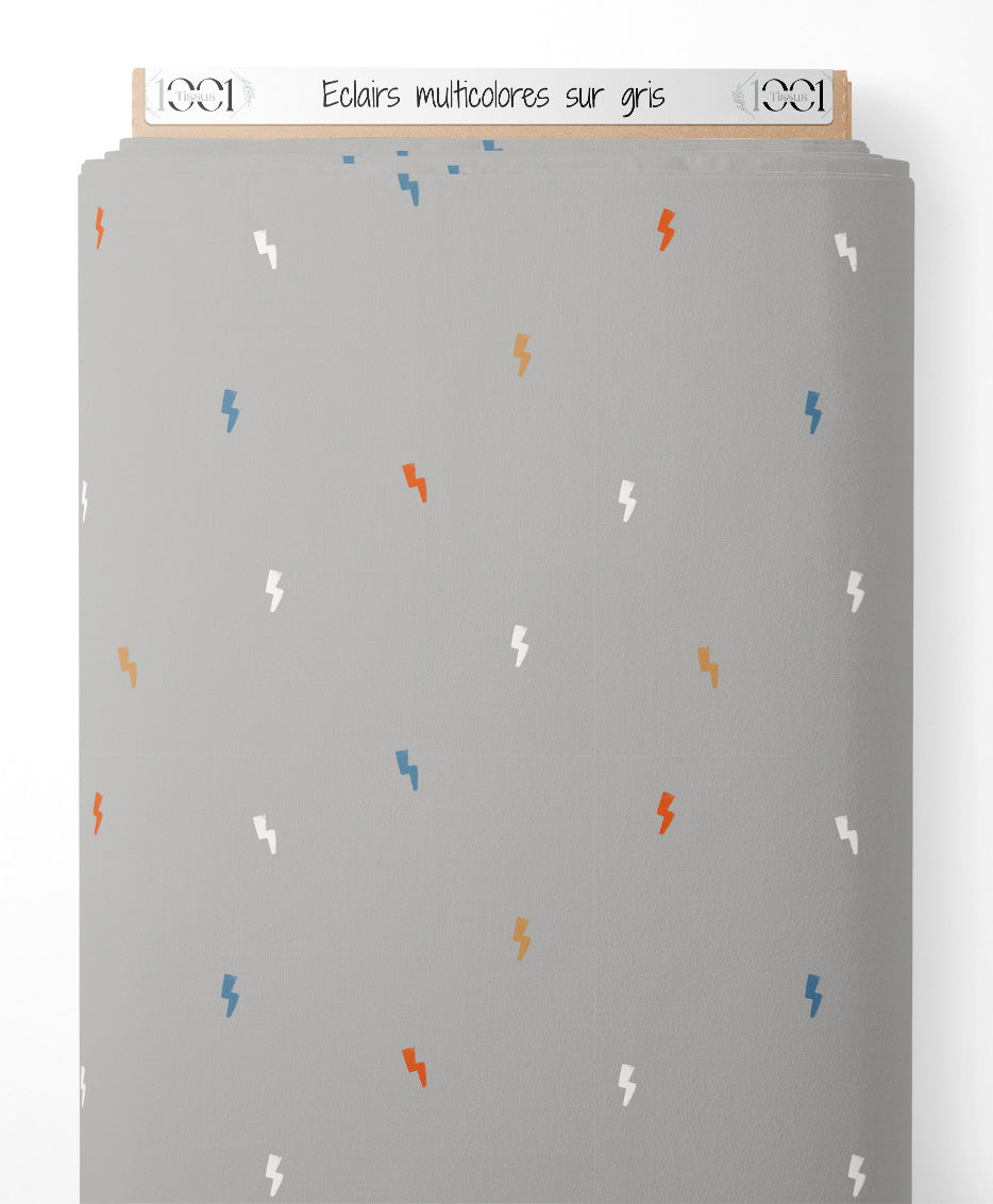 Tissu - Éclairs multicolores sur gris
