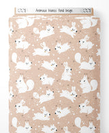 Tissu - Animaux blancs sur fond beige