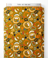 Tissu - Motifs vifs sur fond ocre