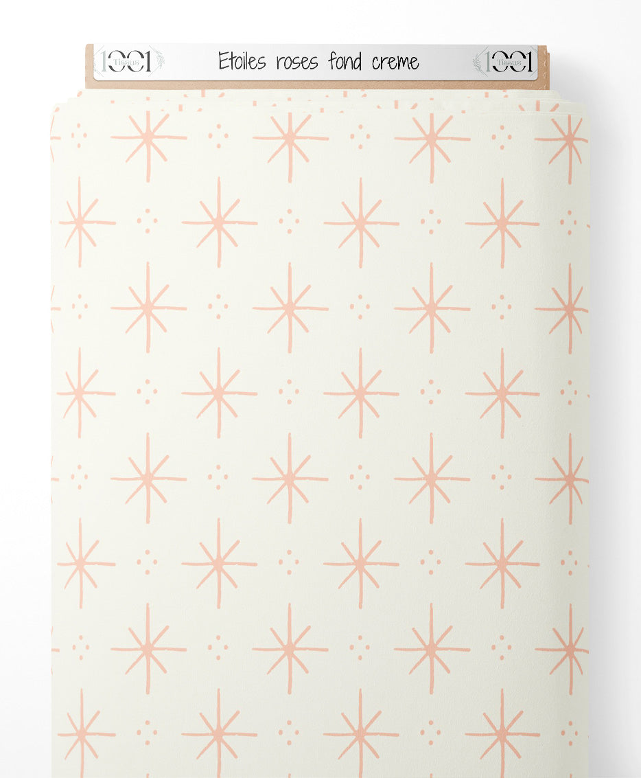 Tissu - Étoiles roses sur fond crème