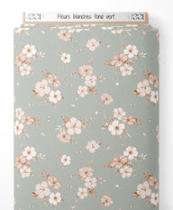 Tissu - Fleurs blanches sur fond vert