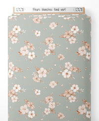 Tissu - Fleurs blanches sur fond vert