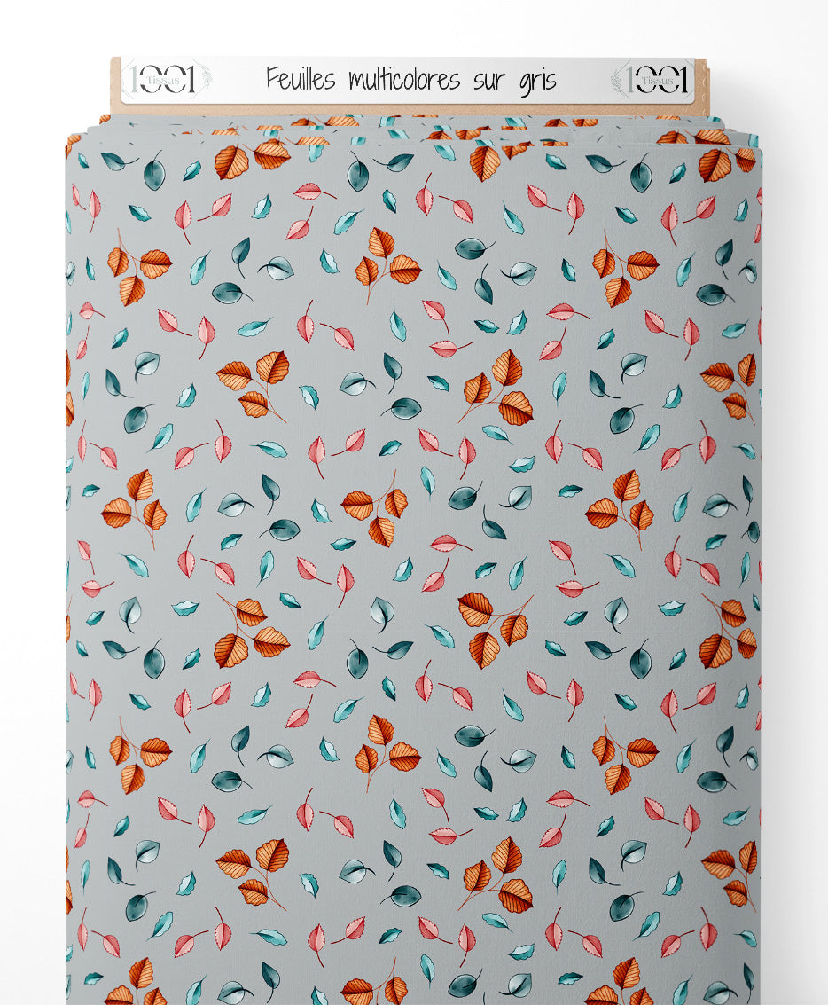 Tissu - Feuilles multicolores sur gris