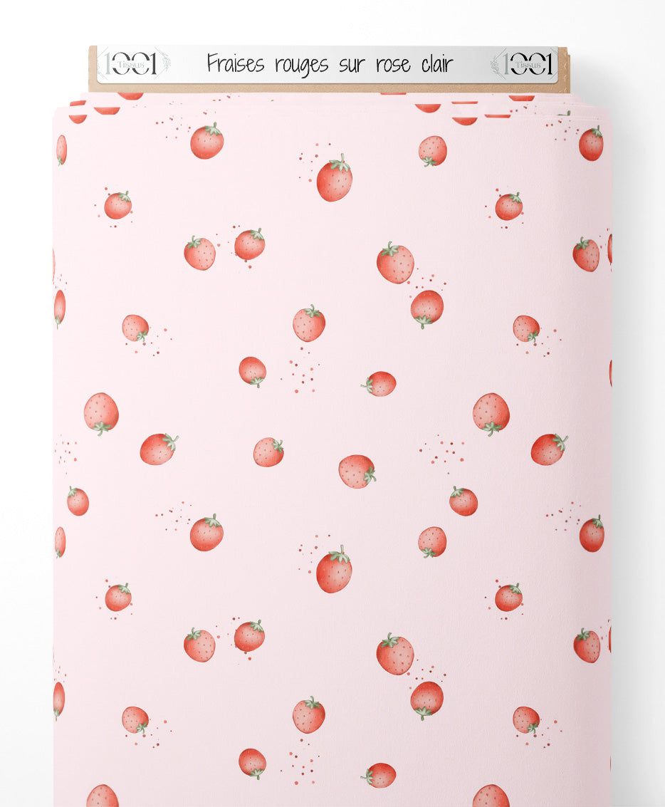 Tissu - Fraises rouges sur rose clair