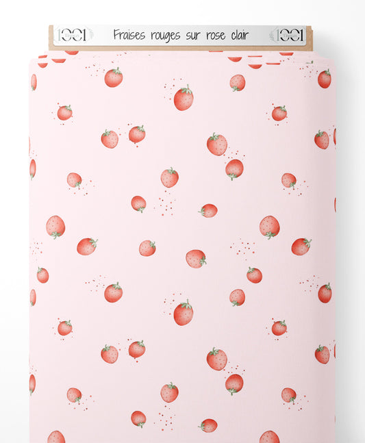 Tissu - Fraises rouges sur rose clair