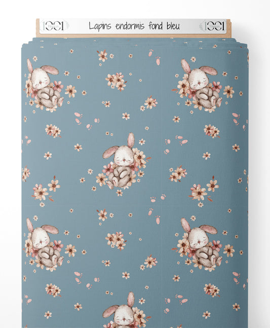 Tissu - Lapins endormis sur fond bleu