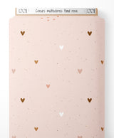 Tissu - Cœurs multicolores sur fond rose