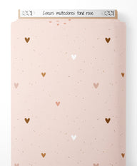 Tissu - Cœurs multicolores sur fond rose