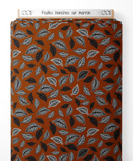 Tissu - Feuilles blanches sur marron