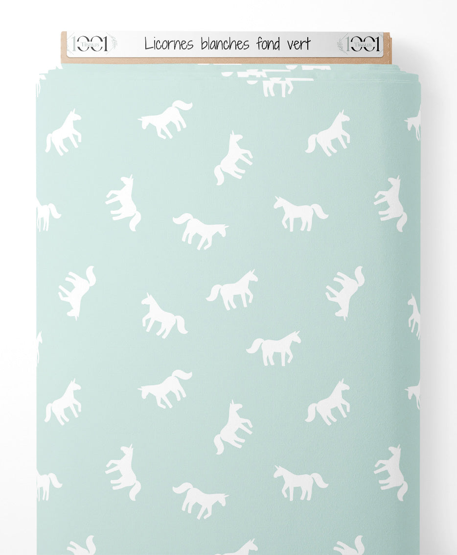 Tissu - Licornes blanches sur fond vert