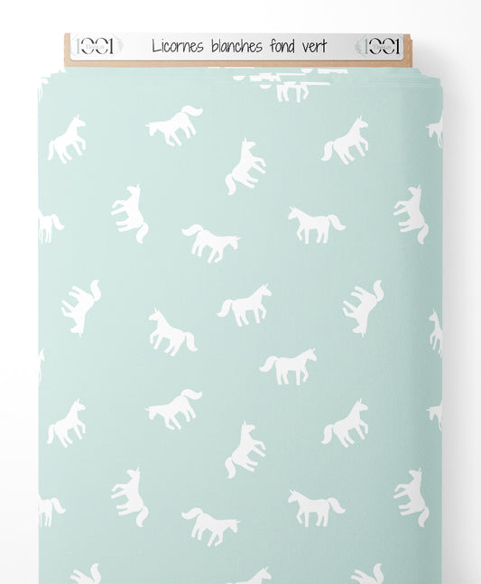 Tissu - Licornes blanches sur fond vert
