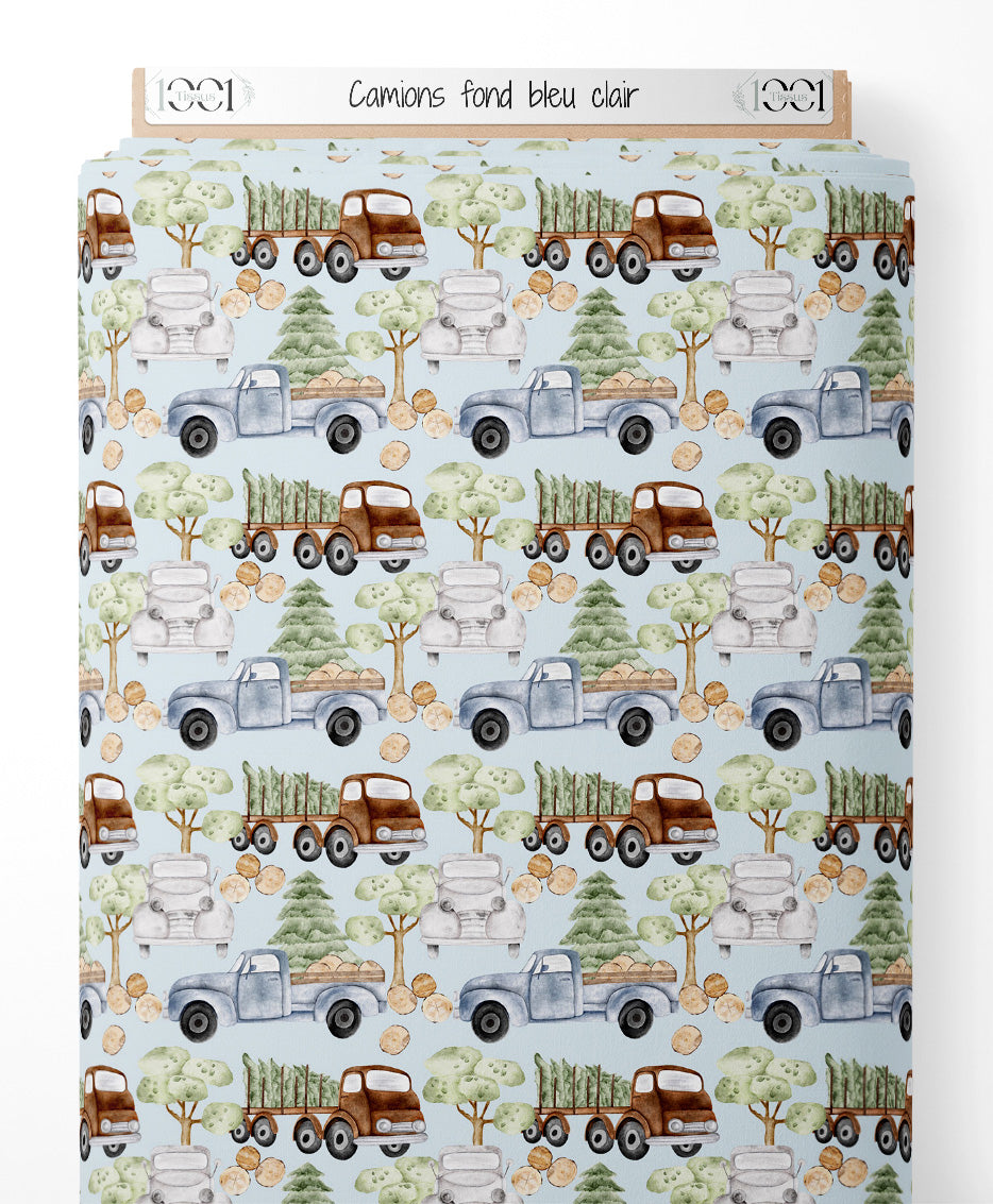 Tissu - Camions sur fond bleu clair