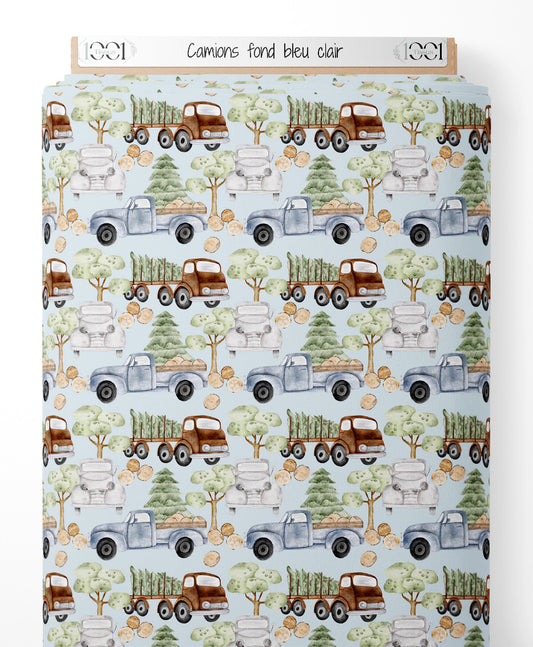 Tissu - Camions sur fond bleu clair