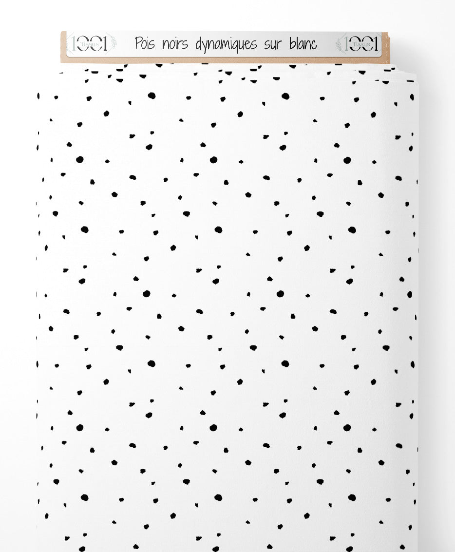 Tissu - Pois noirs dynamiques sur blanc