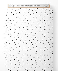 Tissu - Pois noirs dynamiques sur blanc