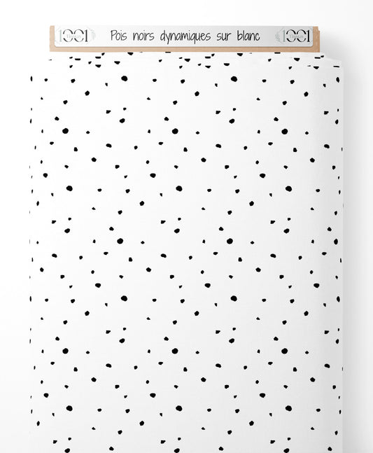 Tissu - Pois noirs dynamiques sur blanc