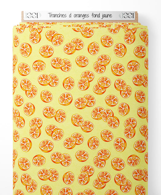 Tissu - Tranches d'oranges sur fond jaune