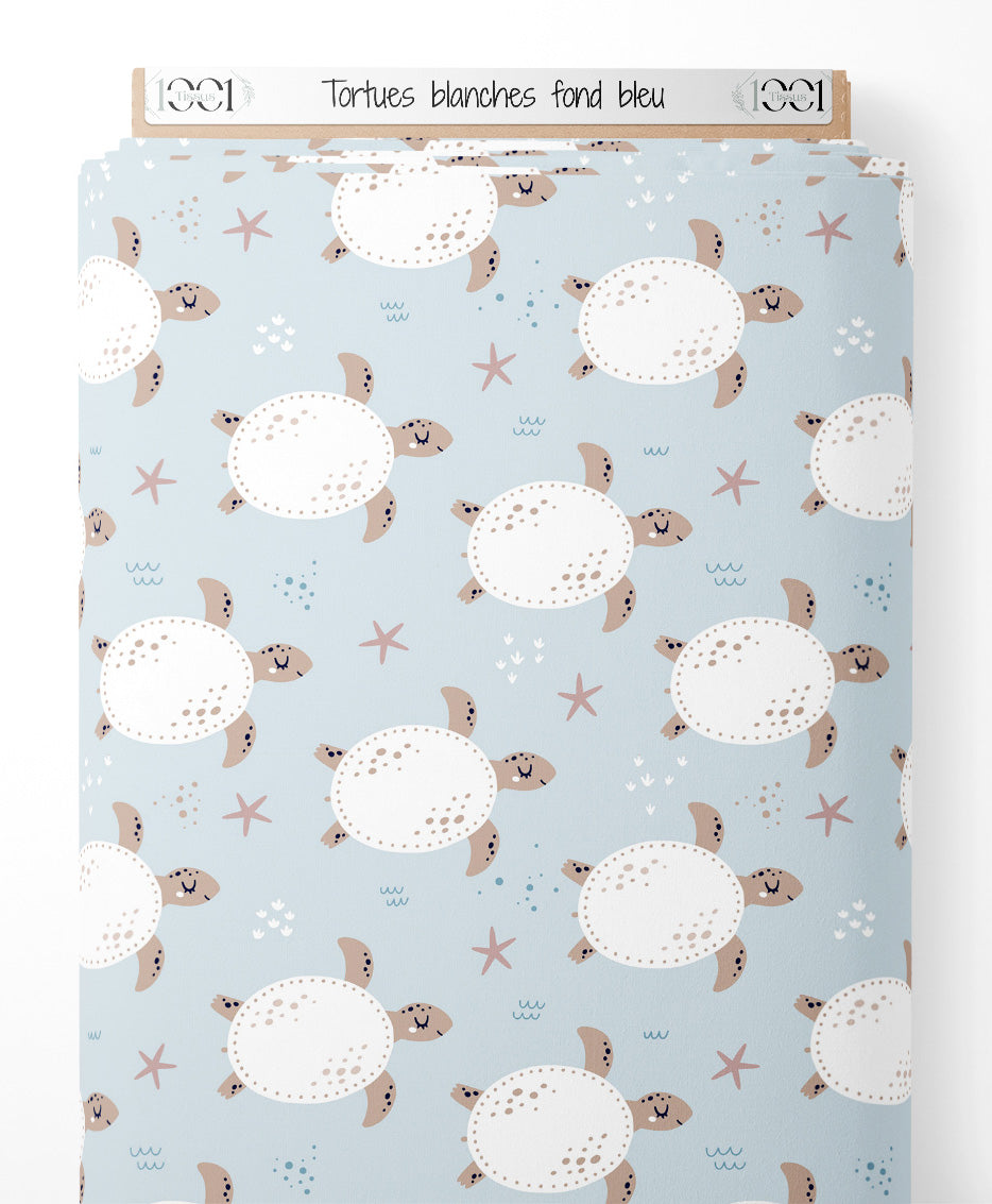 Tissu - Tortues blanches sur fond bleu