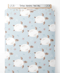 Tissu - Tortues blanches sur fond bleu
