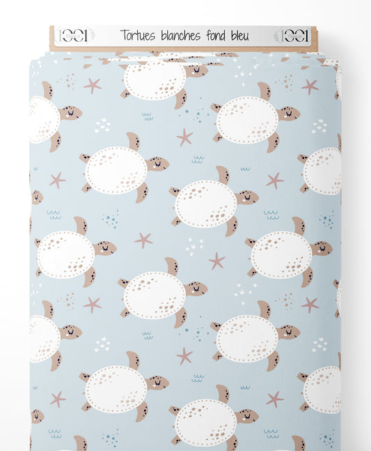 Tissu - Tortues blanches sur fond bleu