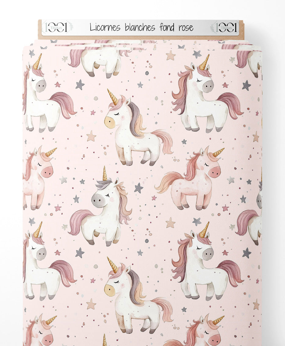 Tissu - Licornes blanches sur fond rose