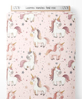 Tissu - Licornes blanches sur fond rose